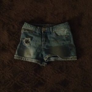 Blue ripped shorts